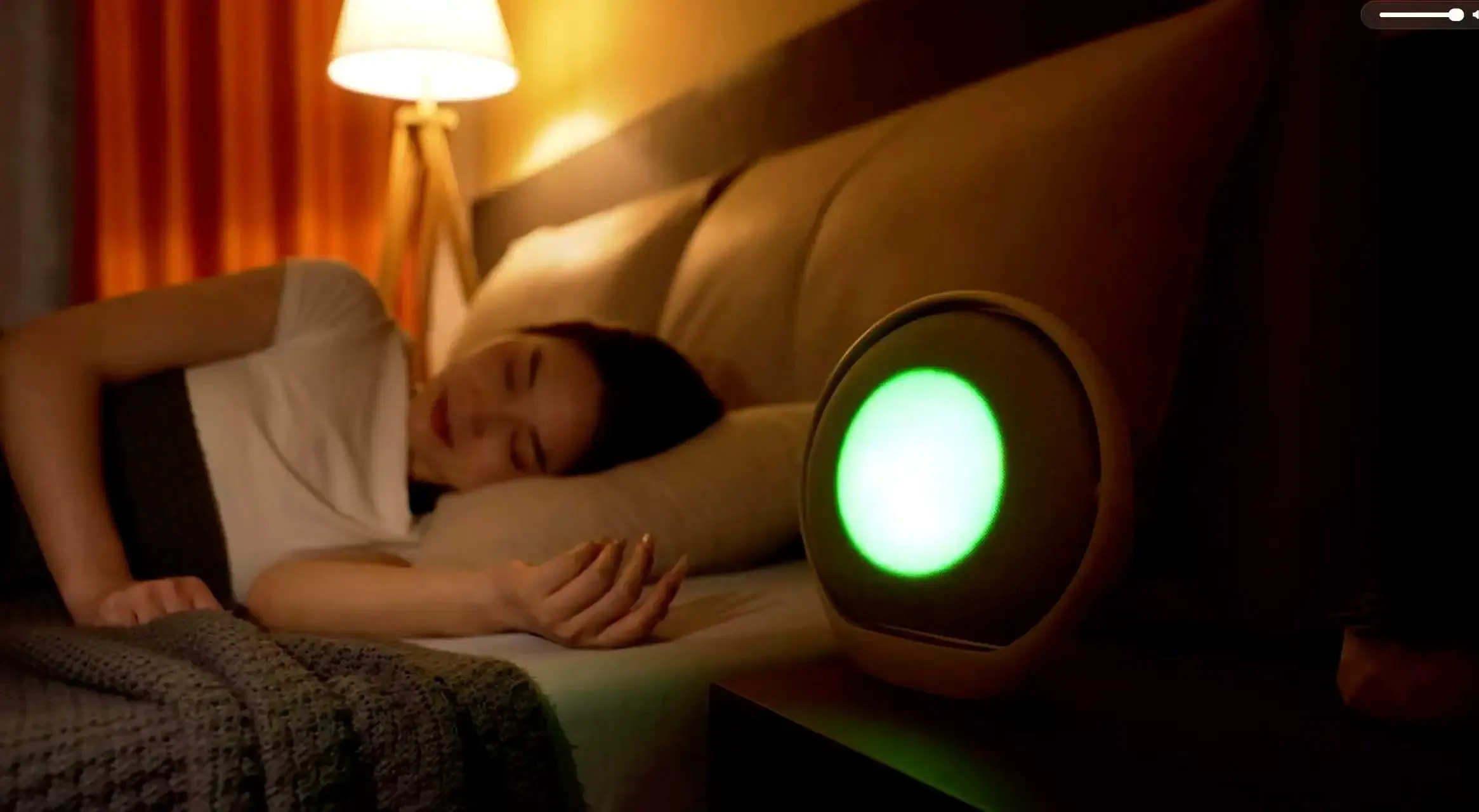 A sleep tracking and sleep-aid device working at night in a bedroom